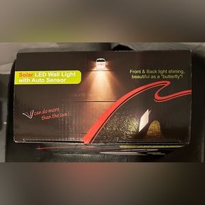 Solar LED Indoor/Outdoor wall light with Auto Sensor. NWT